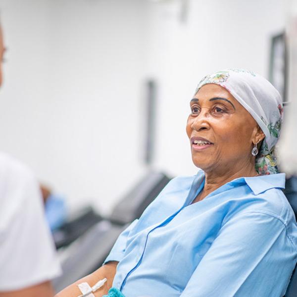 Patient in hospital bed being attended to