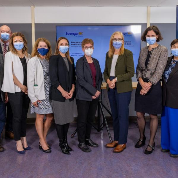 The Honourable Brenda Bailey (fourth from right) joined by members of B.C.’s life sciences community at the clinical trials announcement, including UBC’s Dr. Gail Murphy (fifth from right), Dr. Robert McMaster (third from left) and Dr. Michelle Wong (fifth from left).