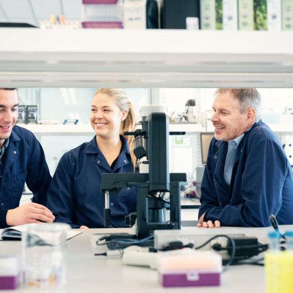 Dr. Peter Zandstra and two colleagues in a scientific lab